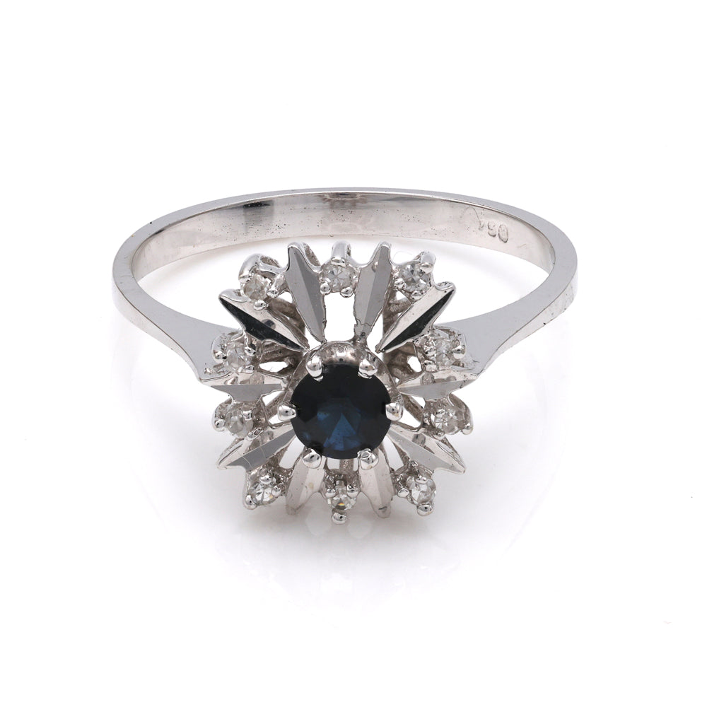 Sapphire ring with diamond accents in white gold.
