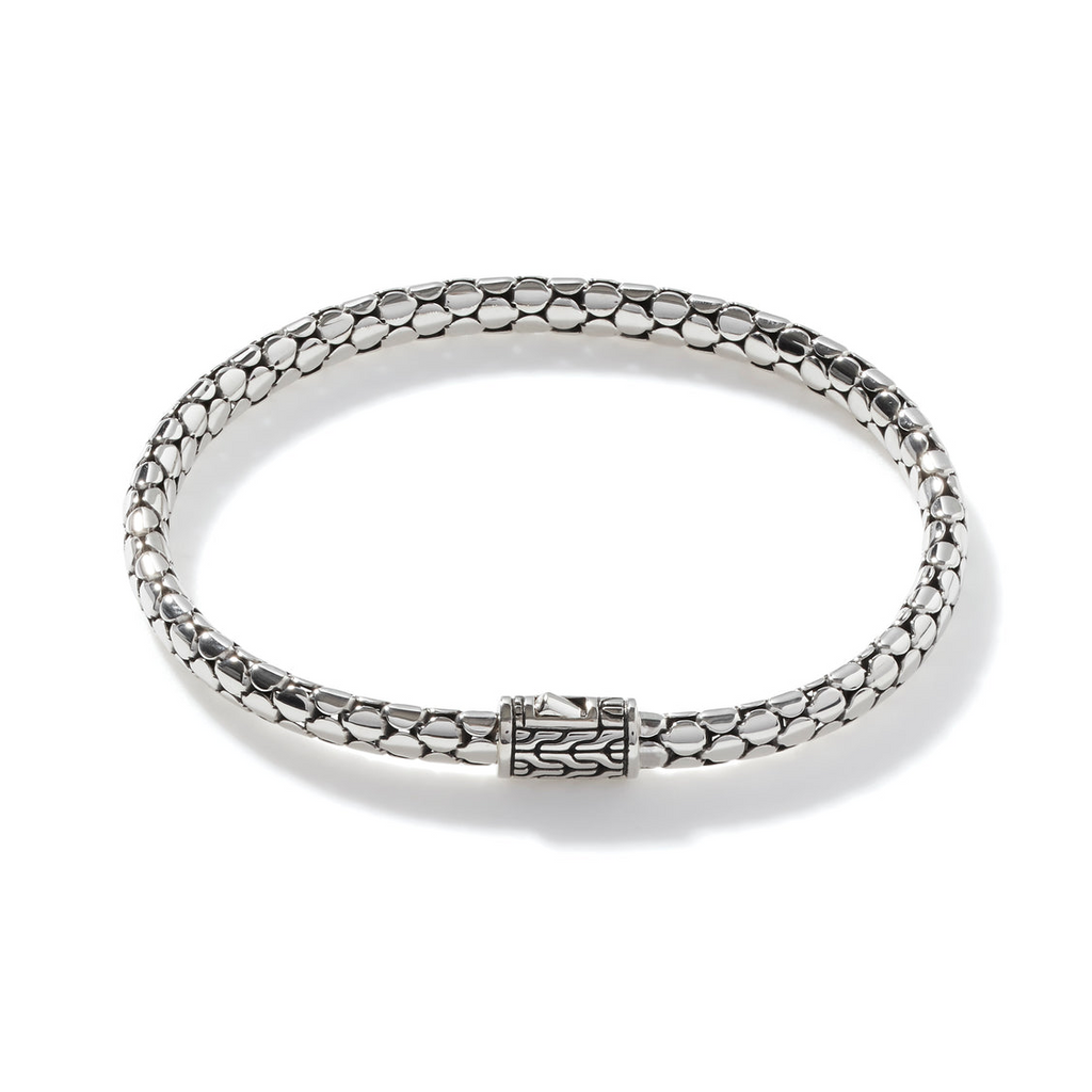 Sterling silver bracelet with dot pattern.