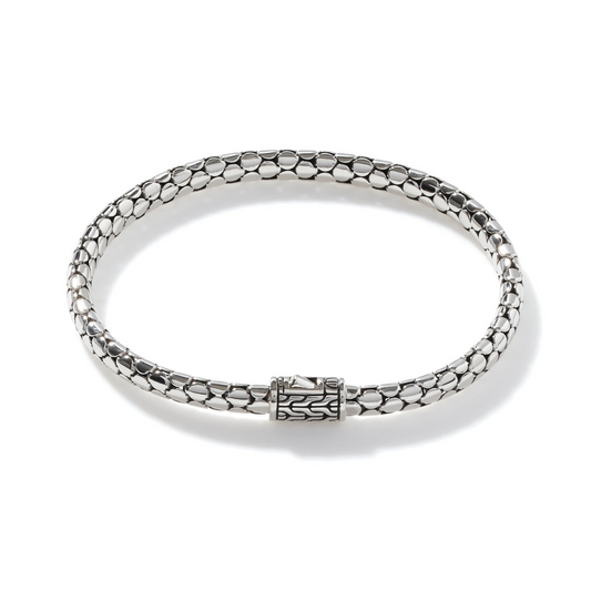 Sterling silver bracelet with dot pattern.