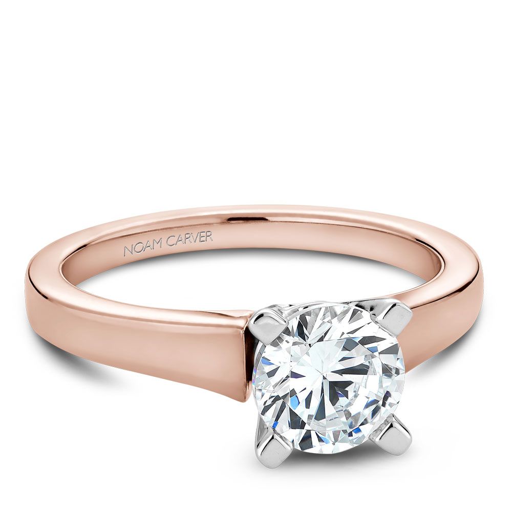 Rose gold ring with solitaire diamond setting.