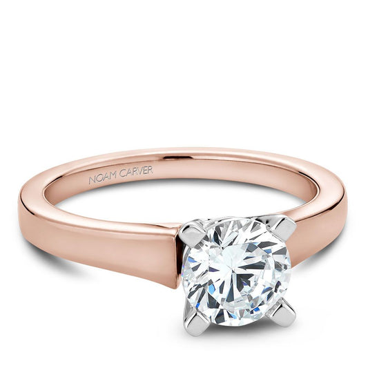 Rose gold ring with solitaire diamond setting.