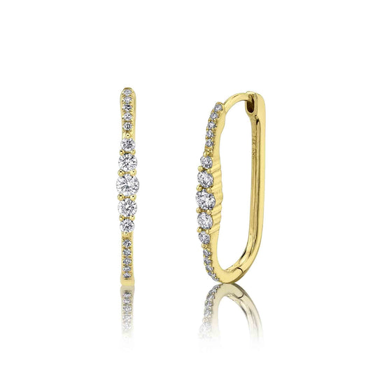 Oval yellow gold earrings with round diamonds.
