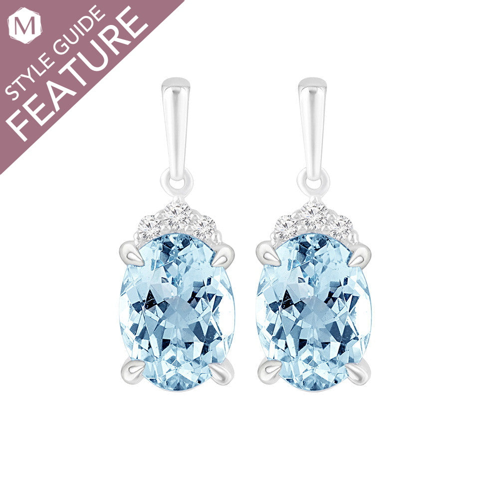Oval blue topaz earrings with diamonds.