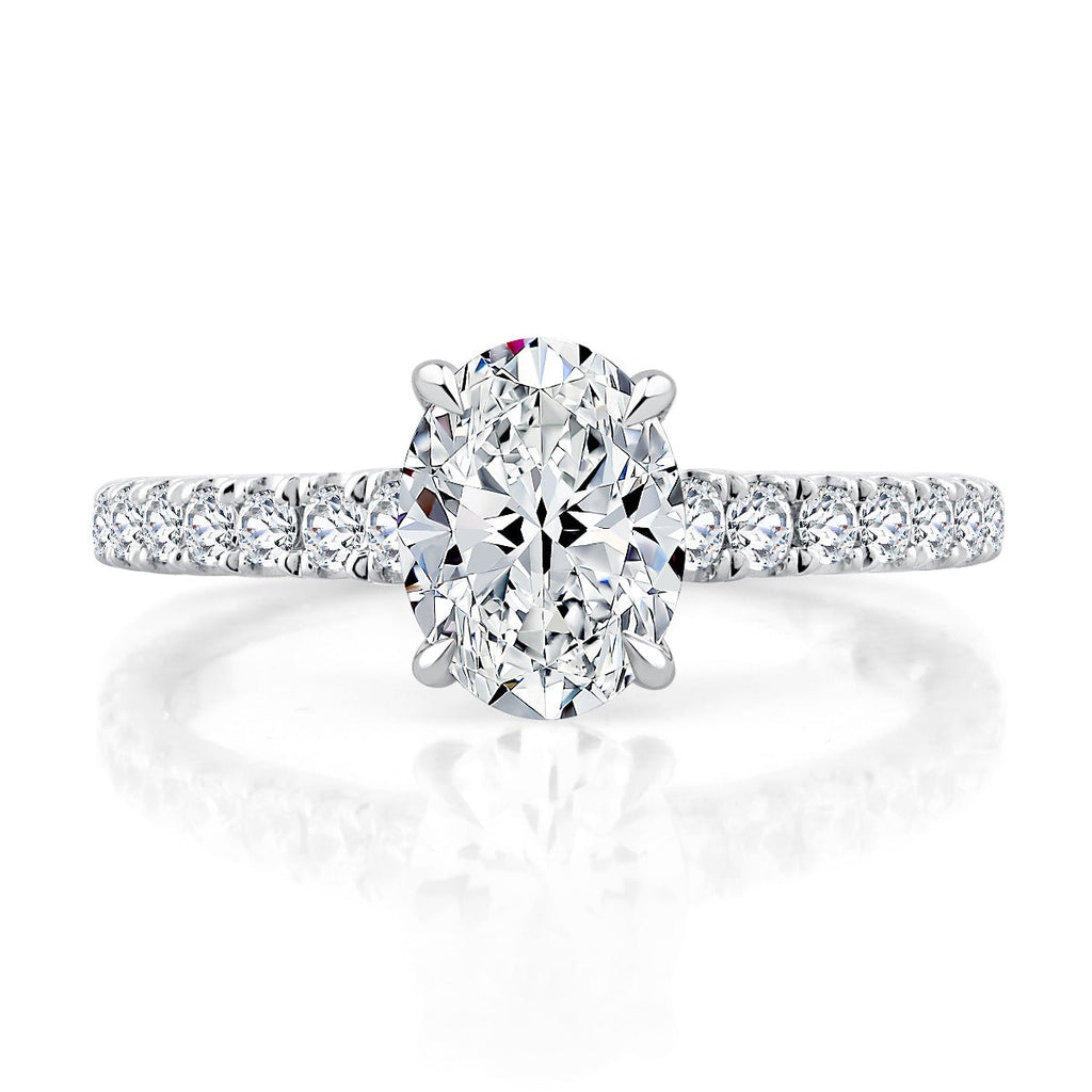 Diamond ring with oval center stone.