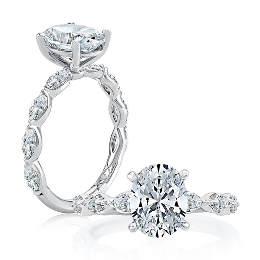 Three-stone diamond ring with marquise accents.