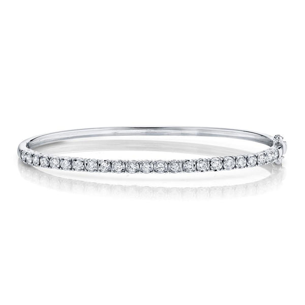 Diamond bangle in white gold with clasp.