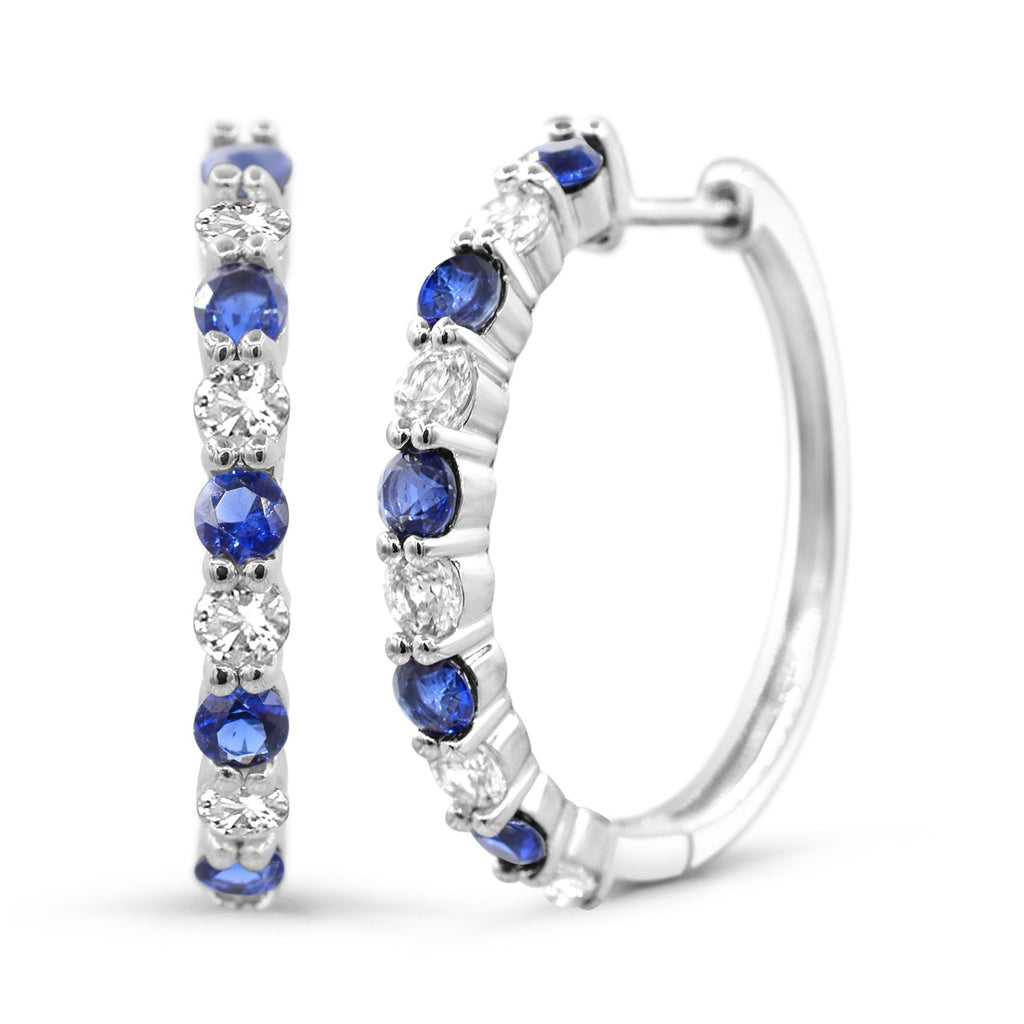 Sterling silver hoops with blue sapphires.