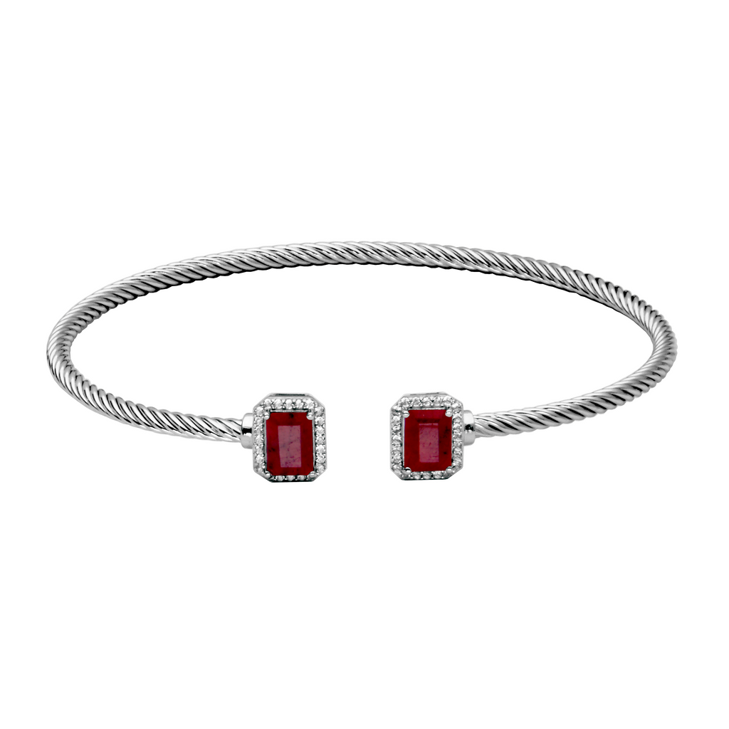 Sterling silver cuff with red gemstones.