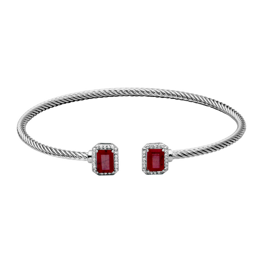 Sterling silver cuff with red gemstones.