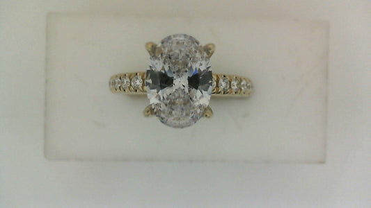 Oval diamond yellow gold engagement ring.
