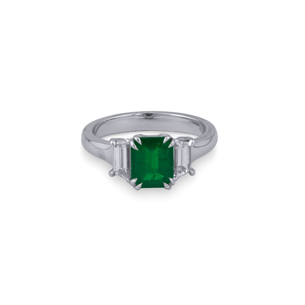Emerald ring with trapezoid diamonds, white gold.