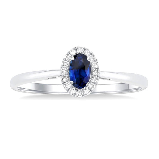 Oval sapphire ring with diamond halo.