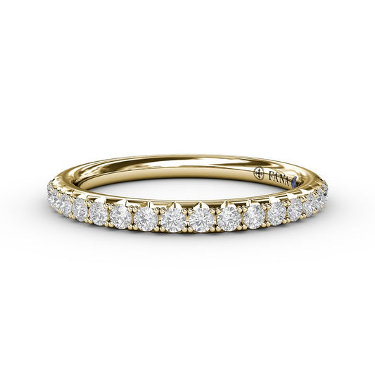 Yellow gold band with round diamonds and sapphire.