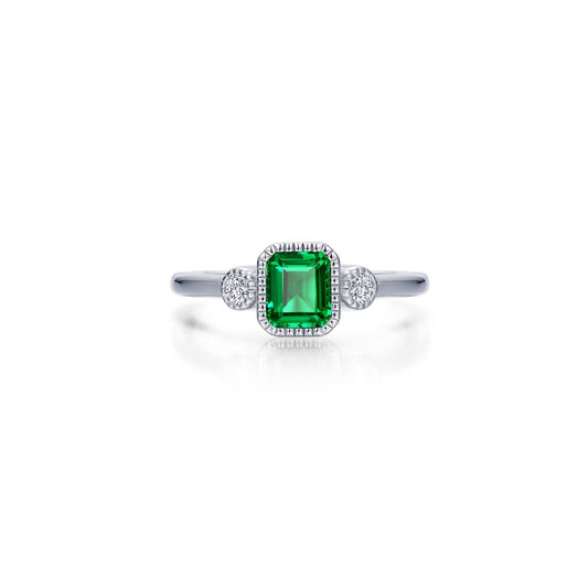 Emerald ring with diamond accents in silver.