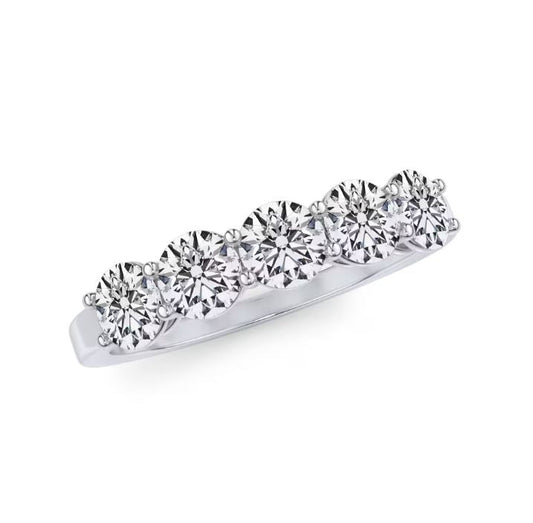 Platinum band with five round diamonds.