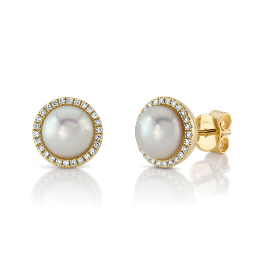Pearl and diamond halo gold earrings.