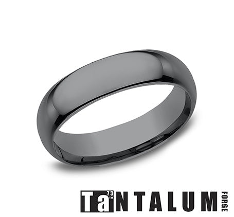 Dark grey tantalum men's carved band.