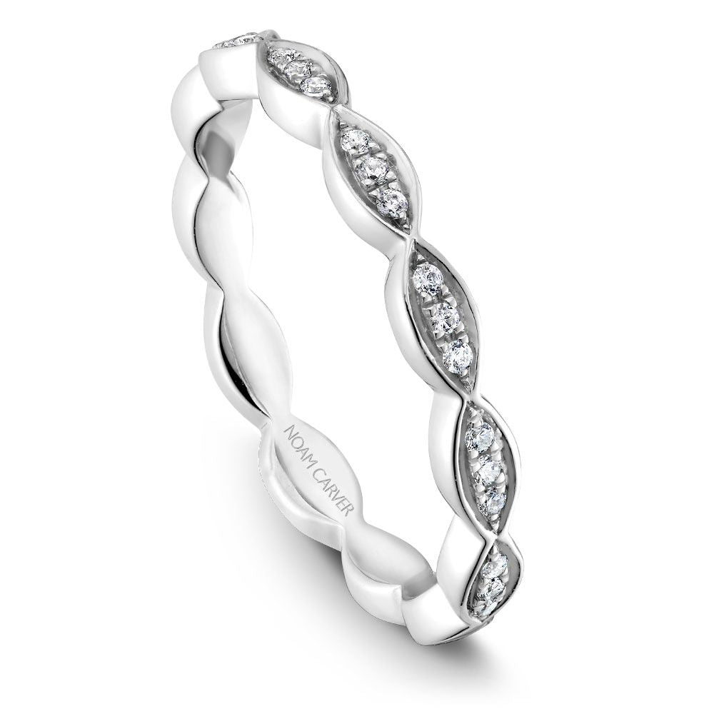 Diamond wedding band with marquise-shaped design.