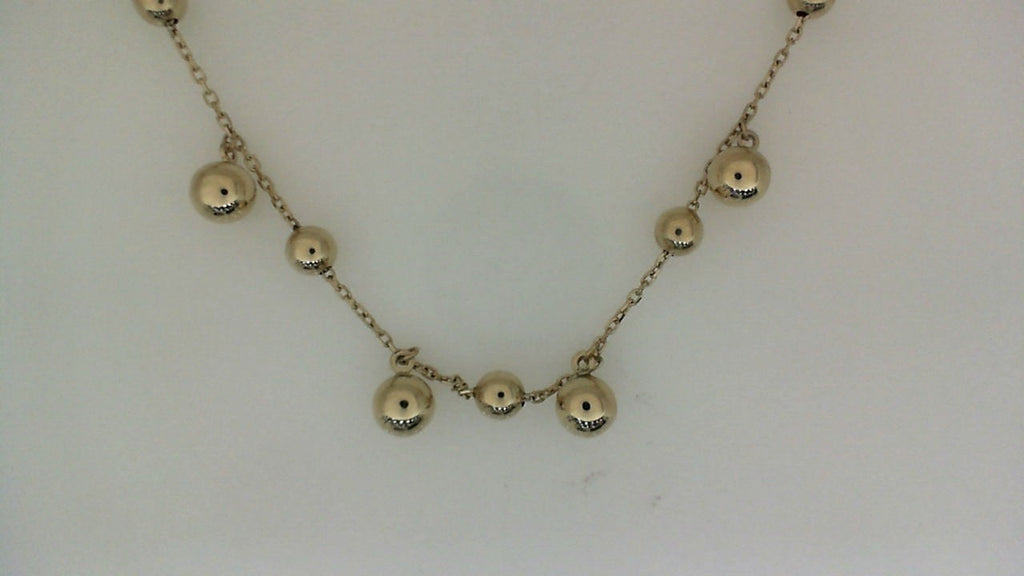 14K yellow gold necklace with round beads.
