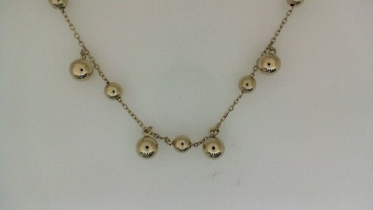 14K yellow gold necklace with round beads.