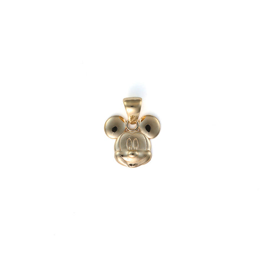 Gold pendant shaped like a cartoon character.