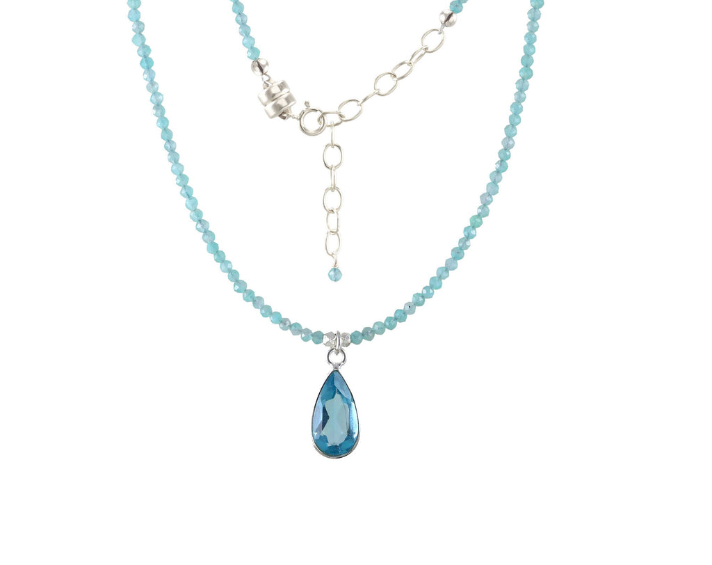 Blue gemstone drop necklace with bead chain.