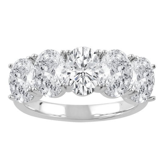 Oval diamond white gold wedding band.