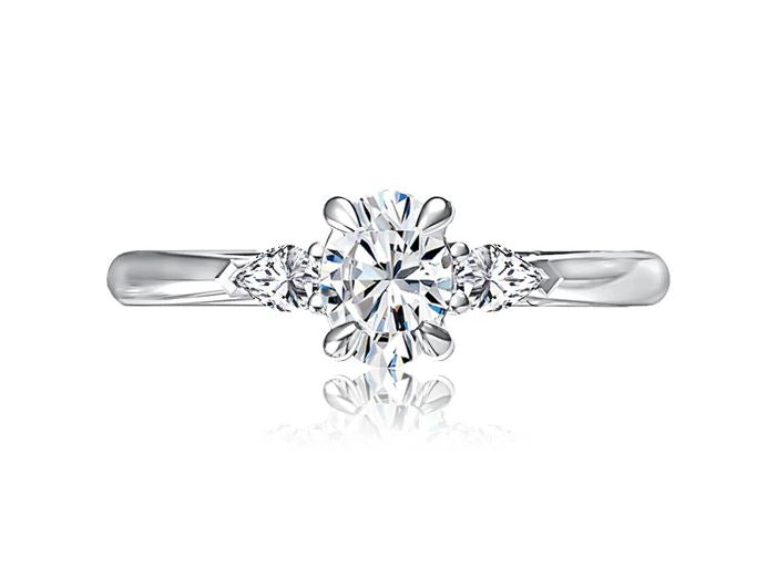 Three-stone diamond ring in white gold.