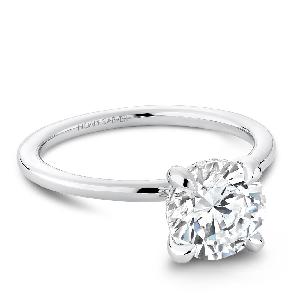 White gold solitaire diamond engagement ring.