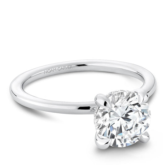 White gold solitaire diamond engagement ring.
