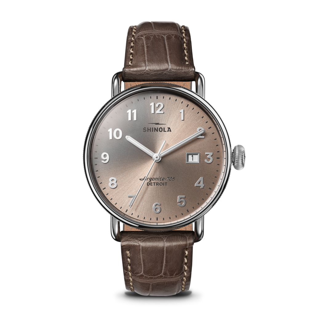 Champagne dial, stainless steel case, alligator band.