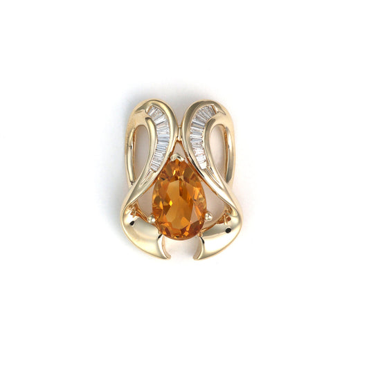 Pear citrine pendant with baguette diamonds.
