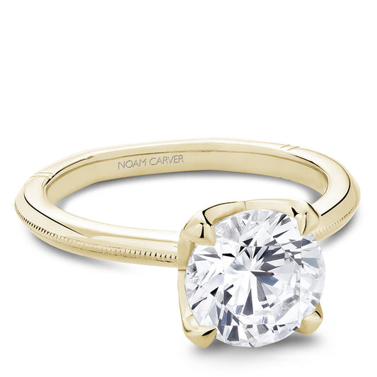 Yellow gold ring with large round diamond.