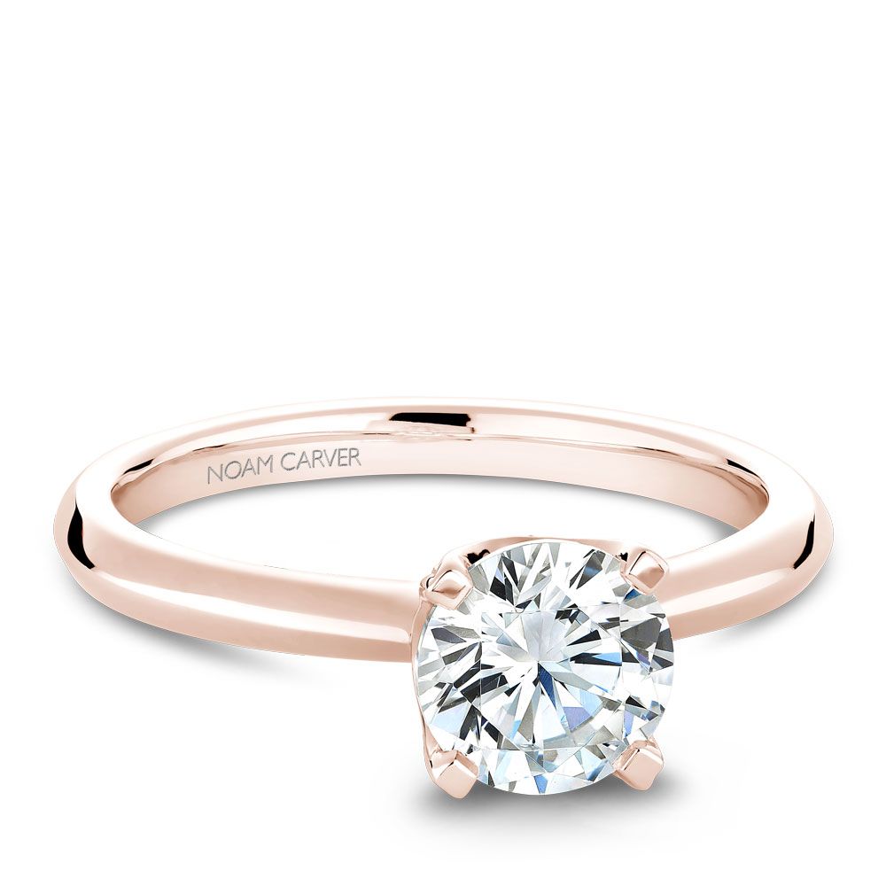 Rose gold solitaire diamond engagement ring.