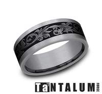 Tantalum titanium band with black engraved design.