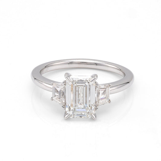 Emerald-cut diamond ring, white gold setting.