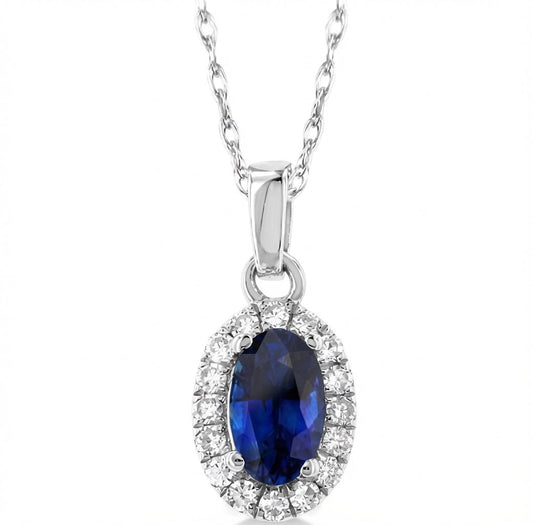 Oval sapphire pendant with diamond halo.