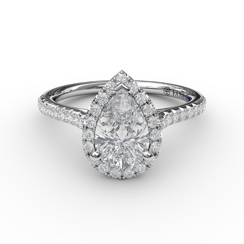 Pear-shaped diamond halo engagement ring.