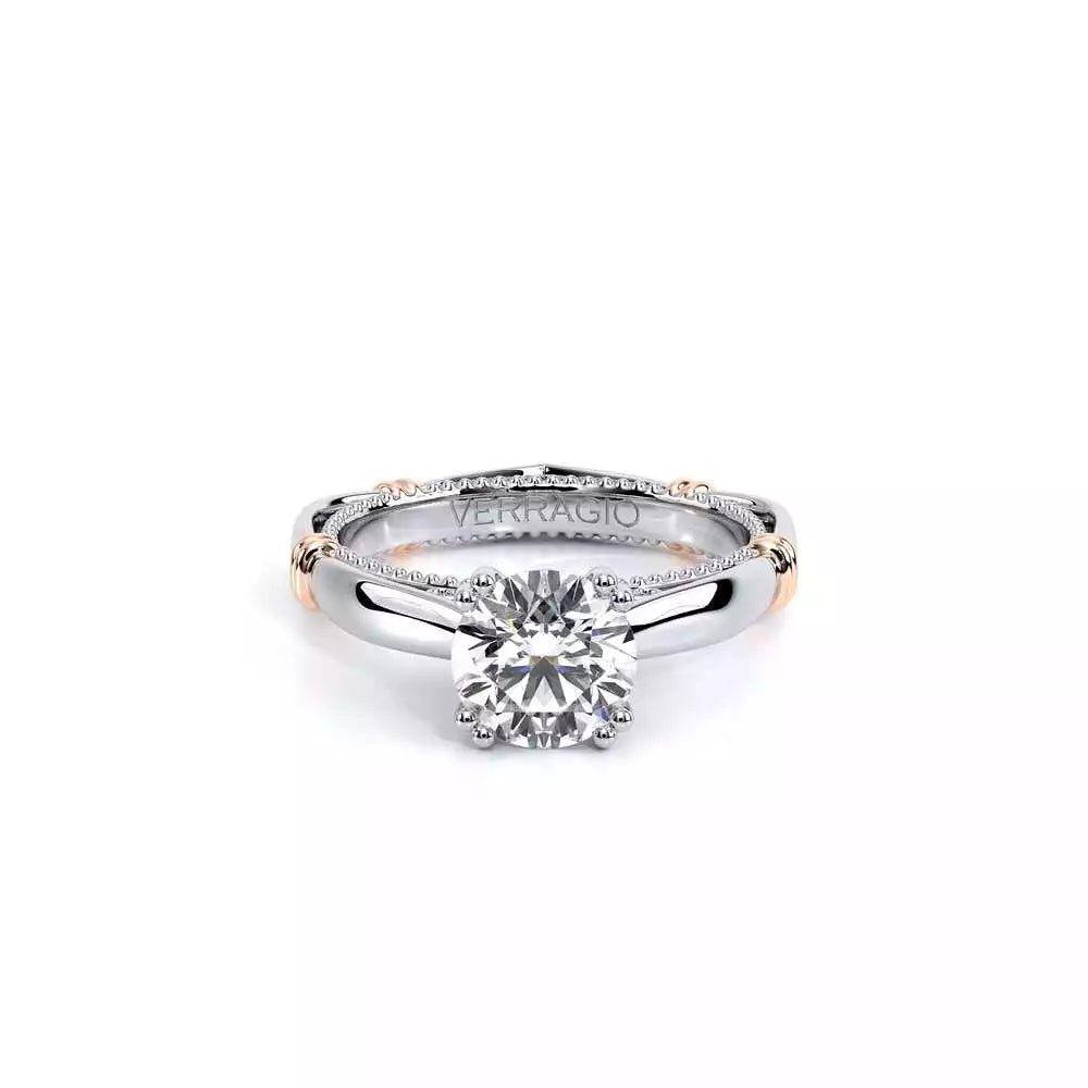 White gold ring with round diamond centerpiece.