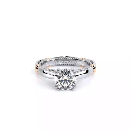 White gold ring with round diamond centerpiece.