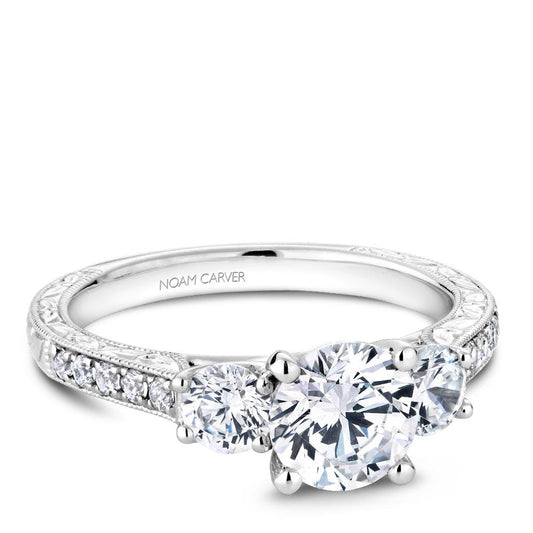 White gold ring with three round diamonds.