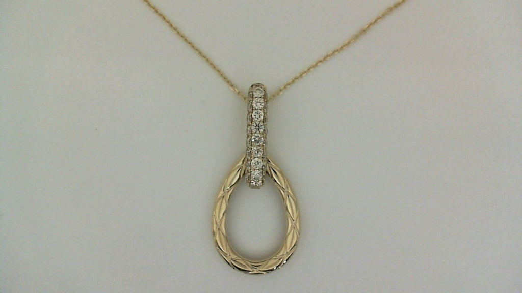 Diamond-studded gold teardrop pendant necklace.