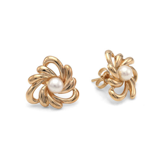 Yellow gold swirl earrings with white pearls.