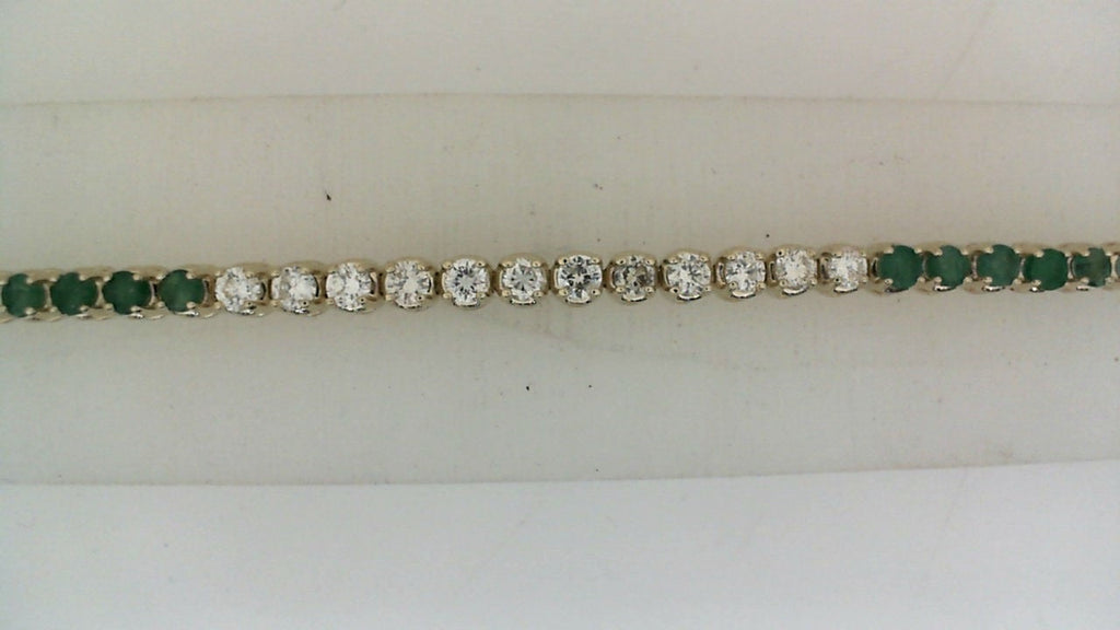 Emerald and diamond tennis bracelet.