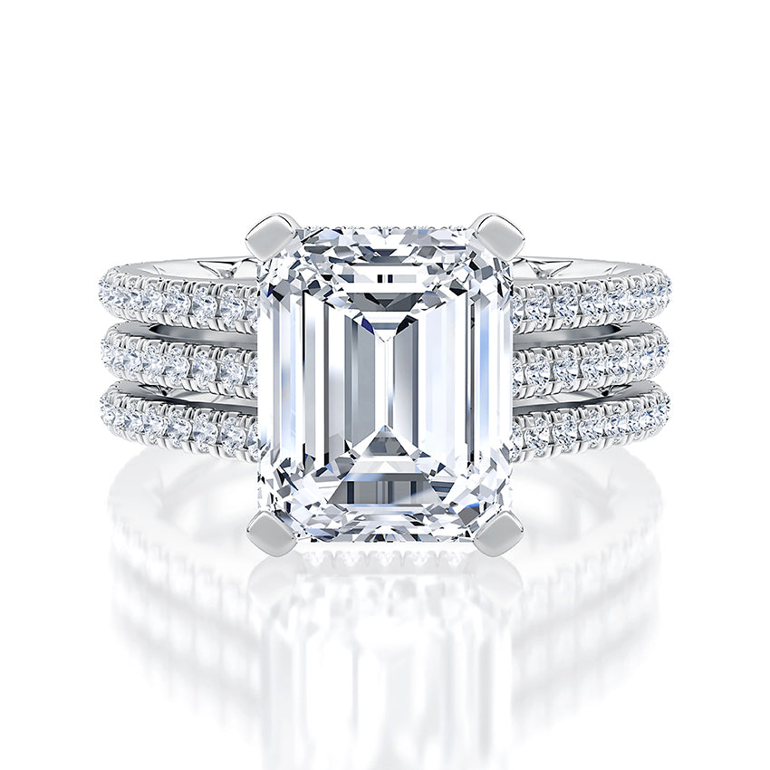 Emerald-cut diamond ring with side stones.