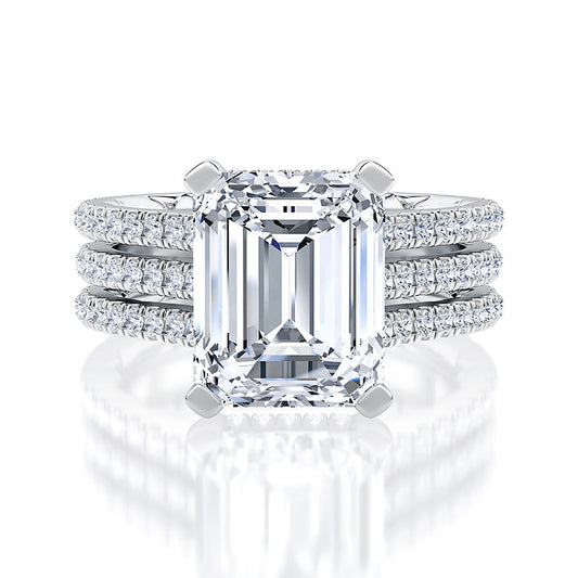 Emerald-cut diamond ring with side stones.