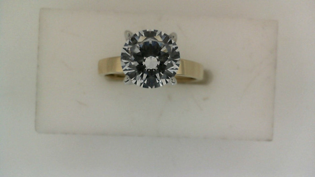 White gold ring with large central diamond.