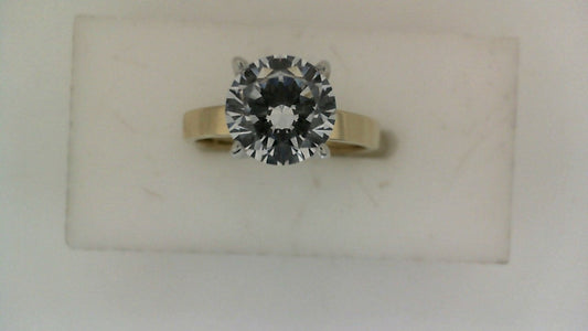 White gold ring with large central diamond.