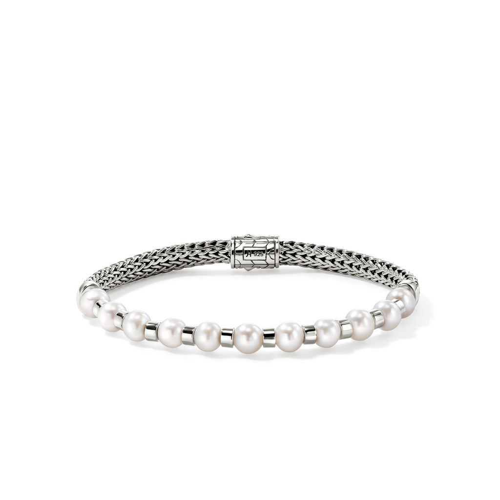 Sterling silver bracelet with cultured pearls.