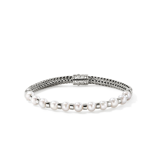 Sterling silver bracelet with cultured pearls.